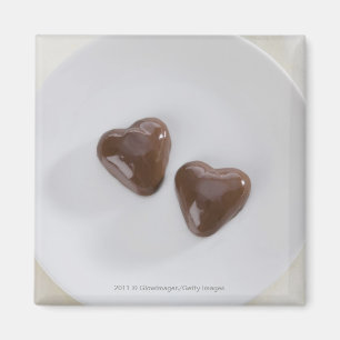 Imã Doces de chocolate dados forma coração em uma
