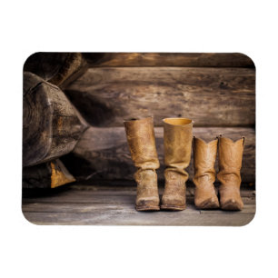 Ímã Dois pares de botas de cowboy Vestidas em cabine