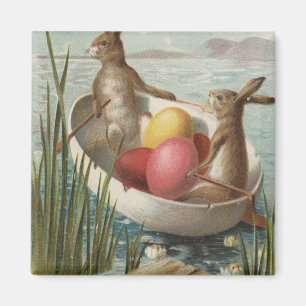 Imã EasterBunnies em um barco com ovos coloridos