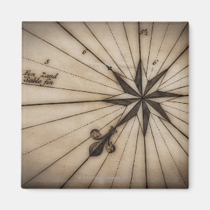 Imã Fechar rosa de vento no mapa antigo