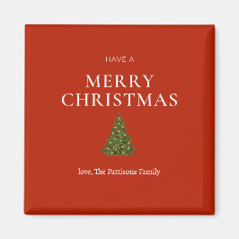 Imã Feliz Natal saudando a árvore de costume vermelho