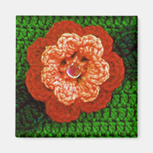 Imã Flor alaranjada com impressão verde do Crochet da