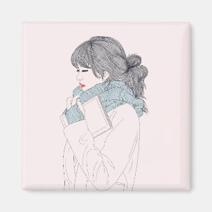 Imã Garota com cachecol e livro