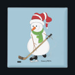 Imã Hockey Snowman Christmas<br><div class="desc">Snowman jogando hóquei no lago.</div>