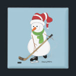 Imã Hockey Snowman Christmas<br><div class="desc">Snowman jogando hóquei no lago.</div>