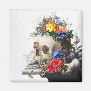 Imã Ímã com caveira e cena de flores.