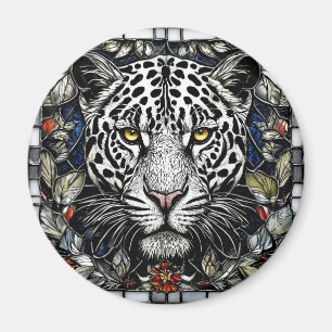 Imã Leopardo preto e branco cercado por flores