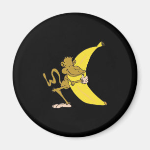 Imã macaco abraçando banana