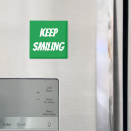 Imã Mantenha o ímã branco verde e sorridente