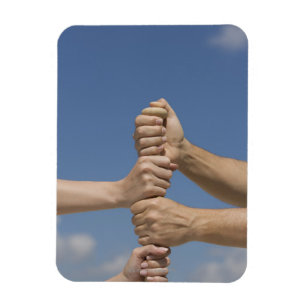 Ímã Mãos da equipe no bastão