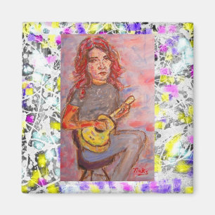 Imã menina com cabelo e o ukulele vermelhos