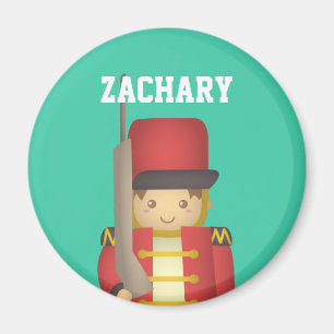 Imã Menino bonito do soldado de brinquedo do Natal no