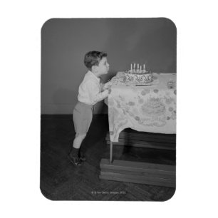 Ímã Menino que funde para fora velas