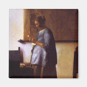 Imã Mulher no azul que lê uma letra