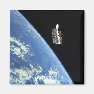 Imã O telescópio espacial de Hubble com uma terra azu
