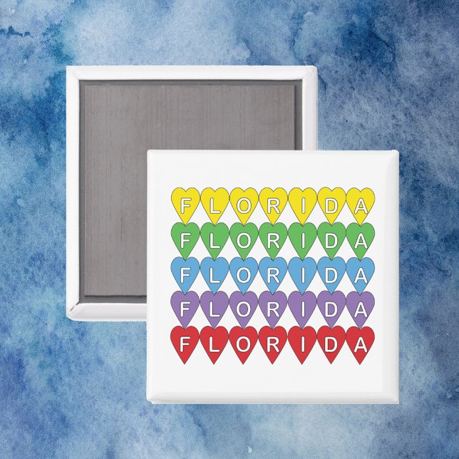 Imã Padrão de Coração Arco-íris da Flórida (A magnet that says Florida with yellow, green, blue, purple and red hearts.)