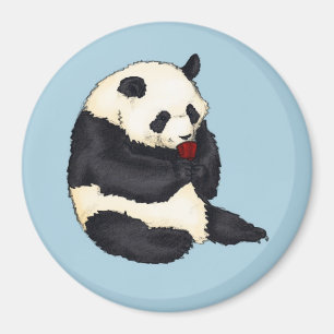 Imã Panda com o copo de chá vermelho