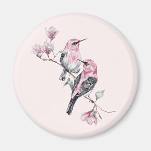 Imã Pássaros rosa e pretos em uma ramificação de árvor
