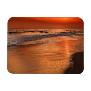 Ímã Reflexões do sol sobre nuvens e costa oceânica