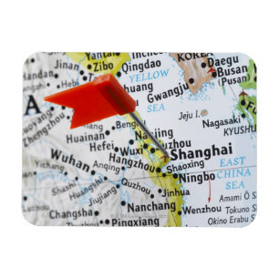 Ímã Trace o pino colocado em Shanghai, China no mapa,