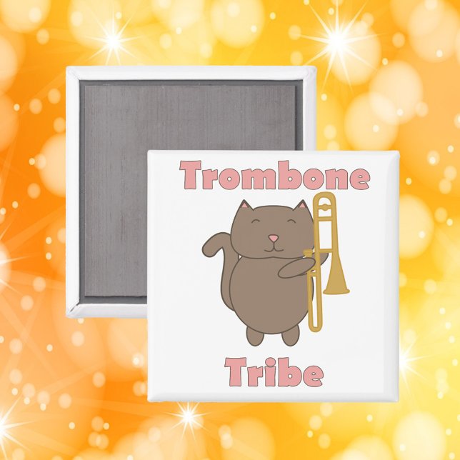 Imã Trombone Tribe Funny Cat Pink Letters (A magnet with a funny cat holding a trombone and the words trombone tribe in pink letters.)