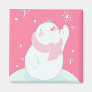 Imã Um boneco de neve que alcança para um floco de