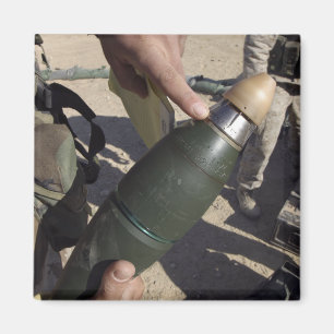 Imã Um líder do pelotão aponta a um ajuste do atraso