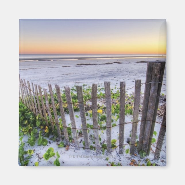 Imã Uma cerca de praia ao pôr do sol (Frente)