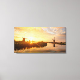 Impressão Em Tela Levantamento do sol sobre moinhos de vento e um ri