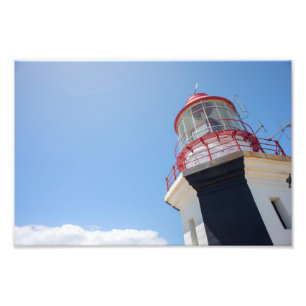 Impressão fotográfica de farol contra o céu