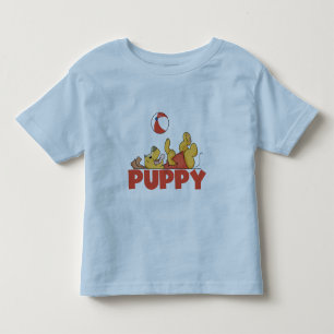 Infantil O filhote de cachorro joga o camiseta e os