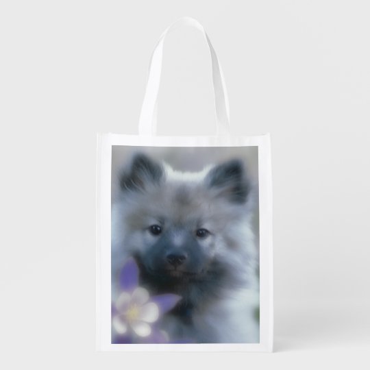 Keeshond com aquilégia sacola ecológica