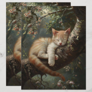 Kitten dormindo em uma árvore de papel de livro di