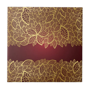 Laço dourado da folha no fundo vermelho
