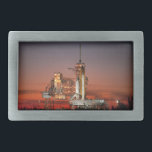 Lançamento do Red Sky for Space Shuttle Atlantis<br><div class="desc">O ar fresco da manhã era elétrico com antecipação, já que os primeiros raios de madrugada pintavam o céu com um vermelho feroz. A colossal silhueta branca do Shuttle Atlantis dominou o bloco de lançamento, ancorado apenas pela imensidão do momento. Um suspiro coletivo estendeu-se pela multidão à medida que as...</div>
