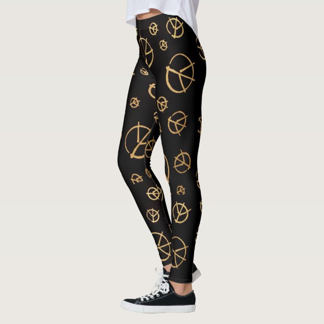 Legging Caneleiras pretas do sinal de paz (Esquerda)
