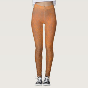 Legging Ferrugem preta, textura metálica fechada.