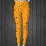 Legging Halloween Cores estrelas pretas em laranja brilhan<br><div class="desc">Estas leggings femininas são feitas em cores do Halloween com um tema celeste coberto por pequenas estrelas pretas em laranja brilhante.</div>