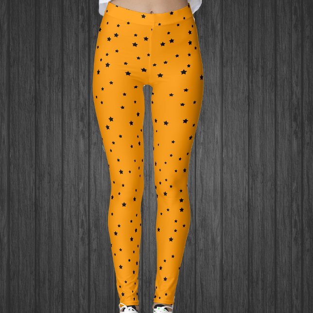 Legging Halloween Cores estrelas pretas em laranja brilhan (Halloween colours of black stars on bright orange celestial womans leggings.)