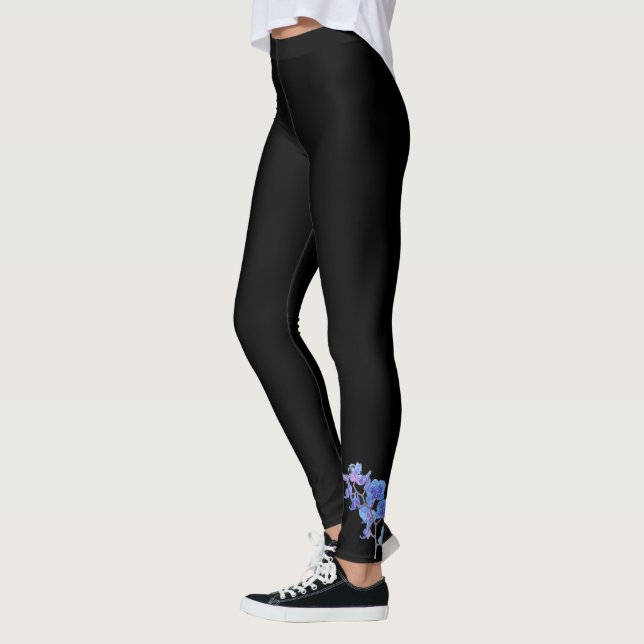 Legging Orquídea Azul nas Legendas Pretas (Esquerda)