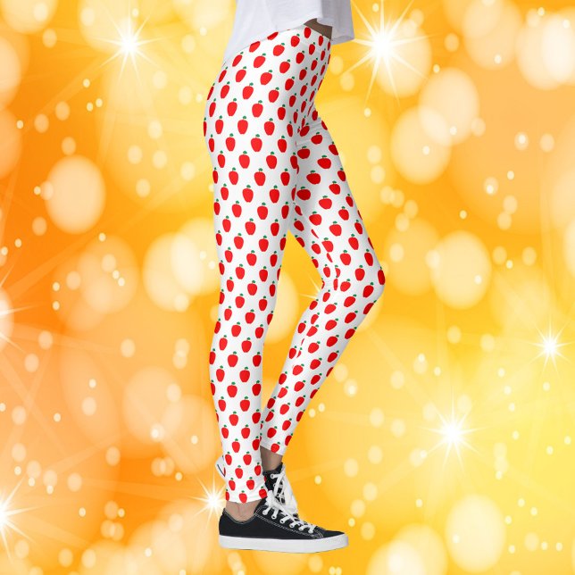 Legging Padrão de Fruta Vermelha da Apple (A pair of leggings with a pattern of red apples.)