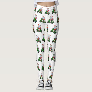 Legging Papais noeis e Sra. Claus andando em patinete