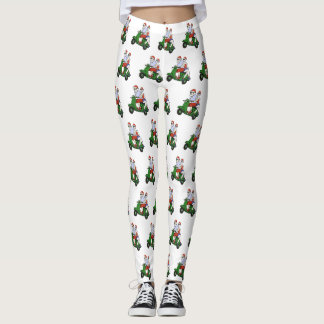 Legging Papais noeis e Sra. Claus andando em patinete