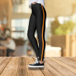 Legging Pernas na moda pretas com faixa lateral laranja<br><div class="desc">Estas elegantes e confortáveis leggings pretas com uma risca laranja arrojada são a adição perfeita ao seu guarda-roupa casual. Projetados para malhação e moda, eles oferecem um ajustado lisonjeiro e estilo atraente. Quer você esteja indo para a academia ou correndo tarefas, essas pernas fornecem a combinação perfeita de conforto e...</div>