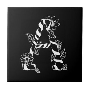 Letra negra e branca "A" com flores geminadas