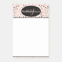 Letras elegantes em dourado rosa em bloco de notas