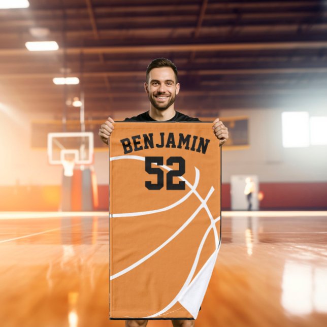 Mão o basquetebol ostenta a toalha, toalha de banho do (Criador carregado)