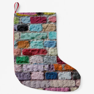 Meia De Natal Pequena Antecedentes da textura pintada do tijolo a cores
