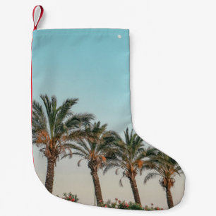 MEIA DE NATAL PEQUENA ÁRVORES VERDE PALM SOB PELE AZUL