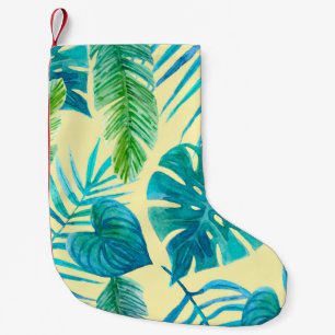 Meia De Natal Pequena Esmague o verde das plantas tropicais da selva. En